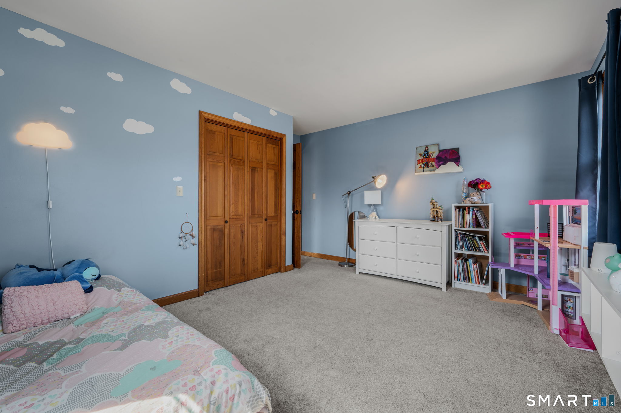 20 Coco Drive Colchester, CT 06415 - Photo 33 of 40 a bedroom with bed and a book shelf