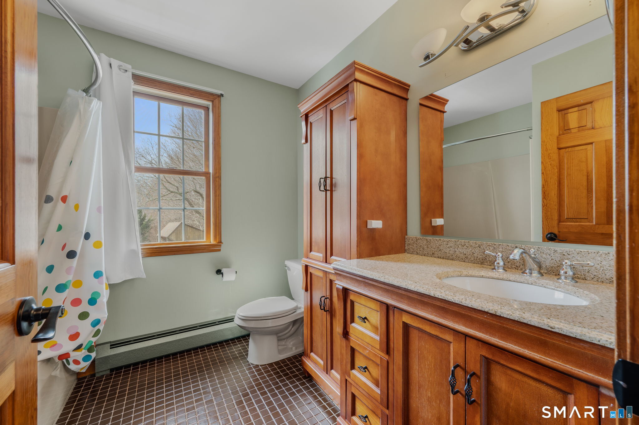 20 Coco Drive Colchester, CT 06415 - Photo 34 of 40 a bathroom with a granite countertop sink a toilet a mirror a vanity and shower