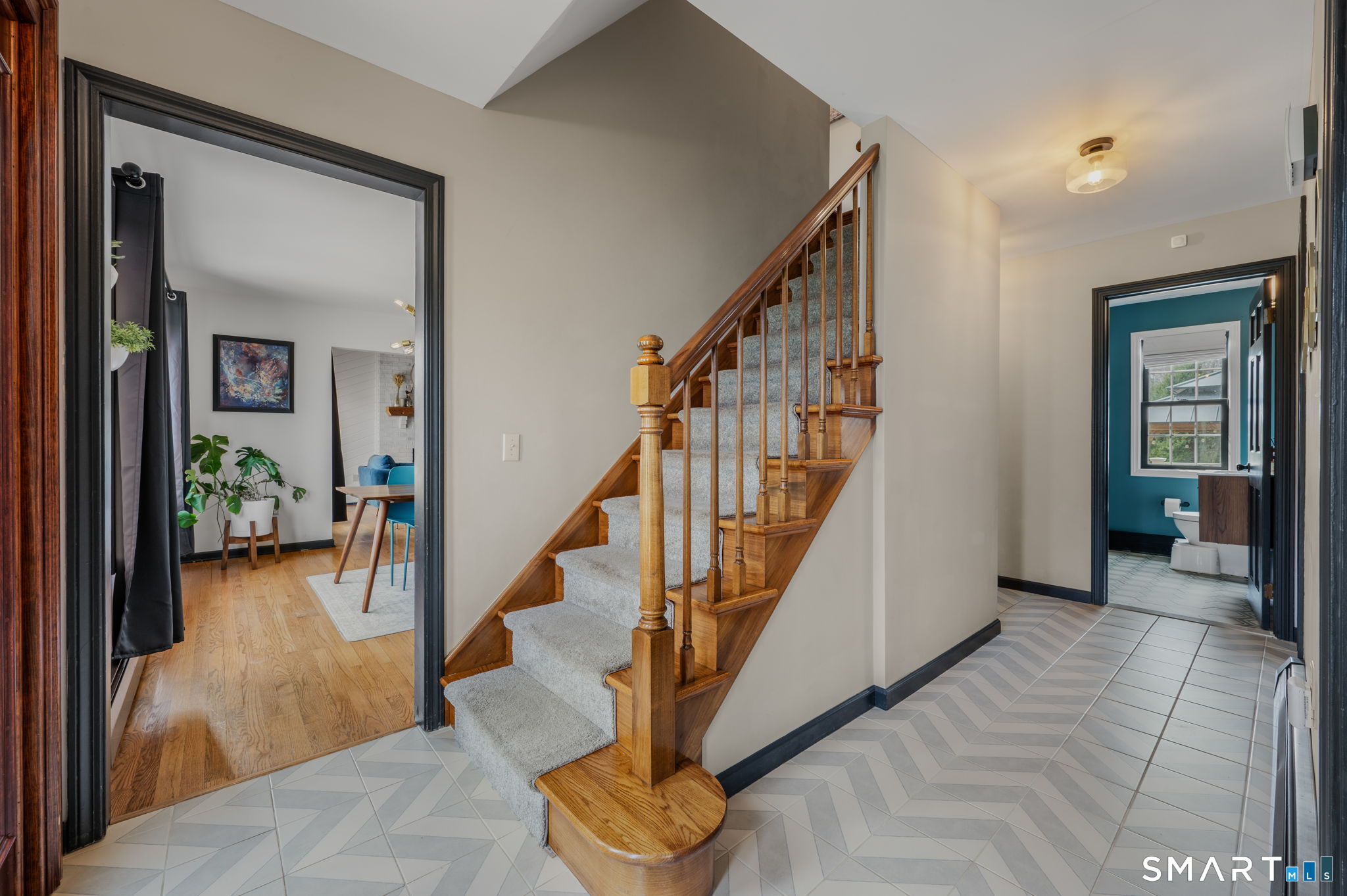 20 Coco Drive Colchester, CT 06415 - Photo 5 of 40 a view of a hallway with wooden floor and stairs
