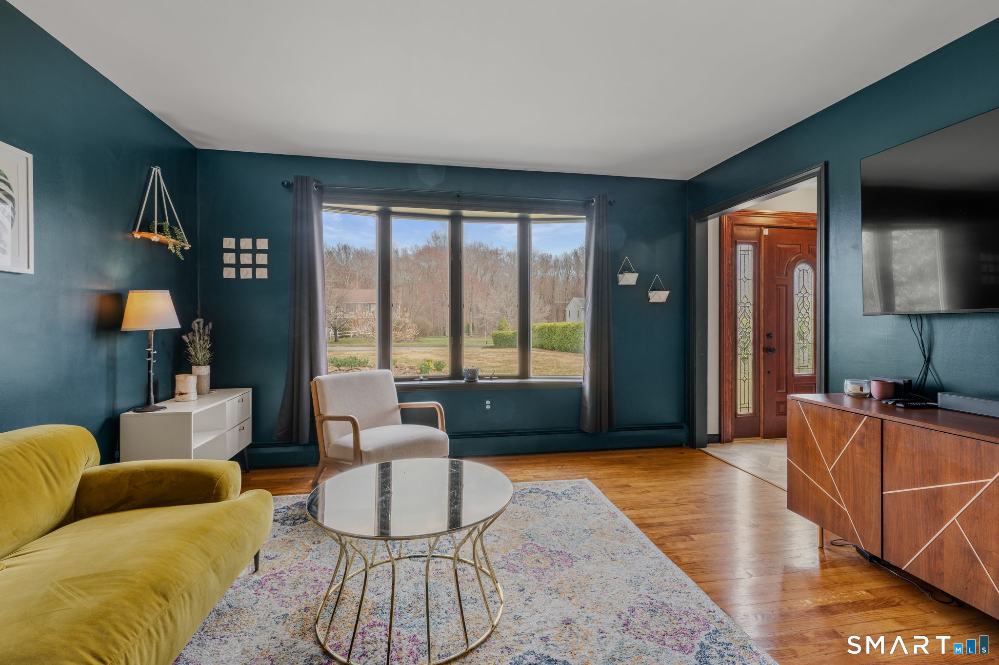 20 Coco Drive Colchester, CT 06415 - Photo 7 of 40 a living room with furniture and a flat screen tv