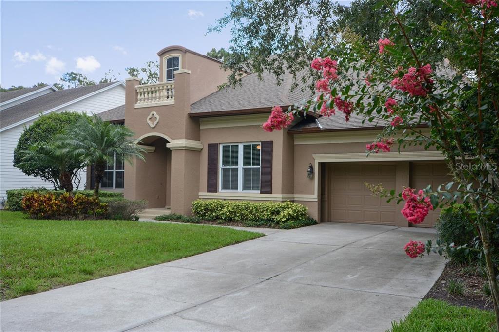 8465 Bowden Way Windermere, FL 34786 - Photo 1 of 1 a front view of a house with a yard and a garage