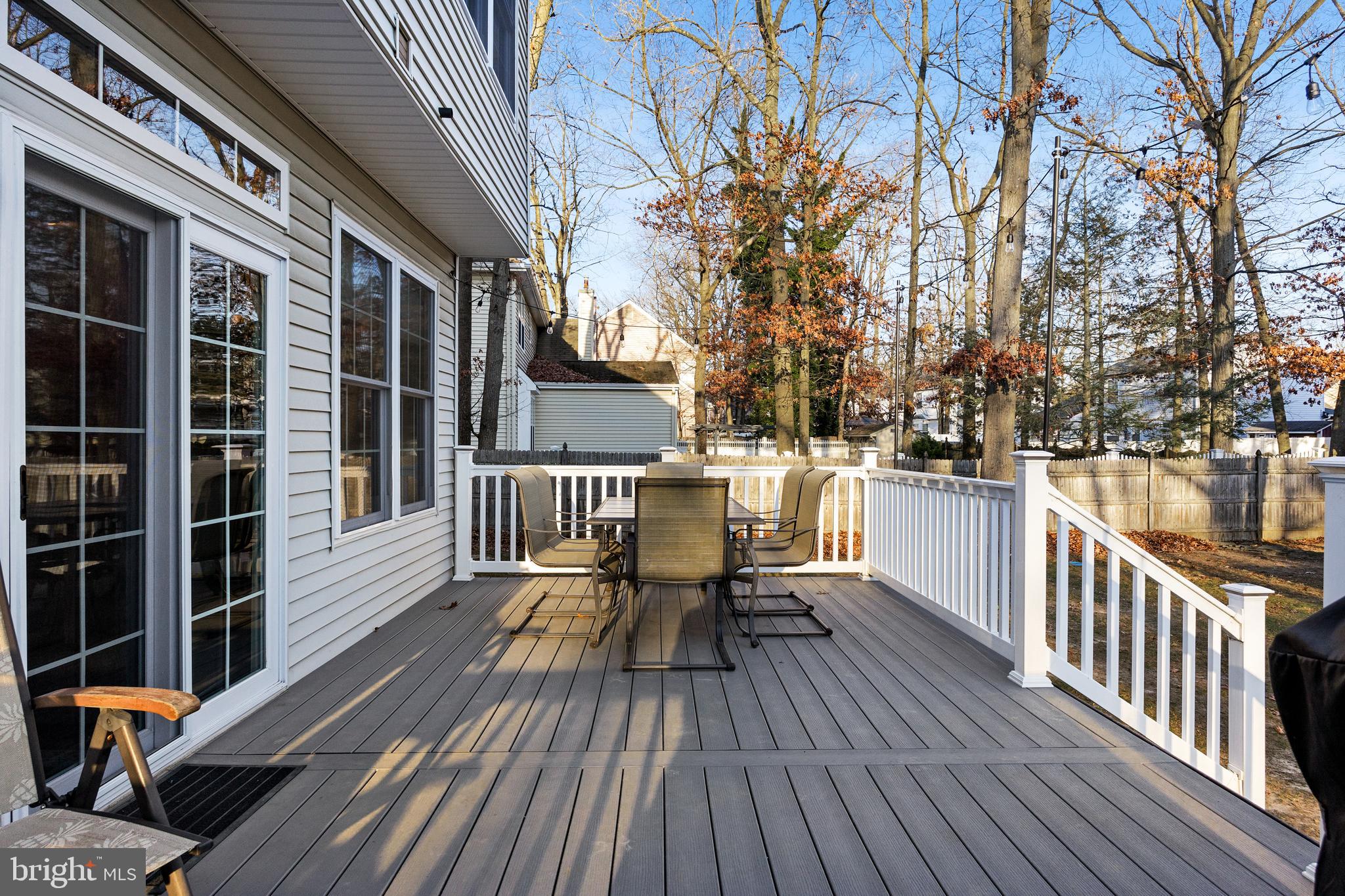 6 Read Drive Sicklerville, NJ 08081 - Photo 34 of 36 a view of a roof deck with table and chairs and wooden floor