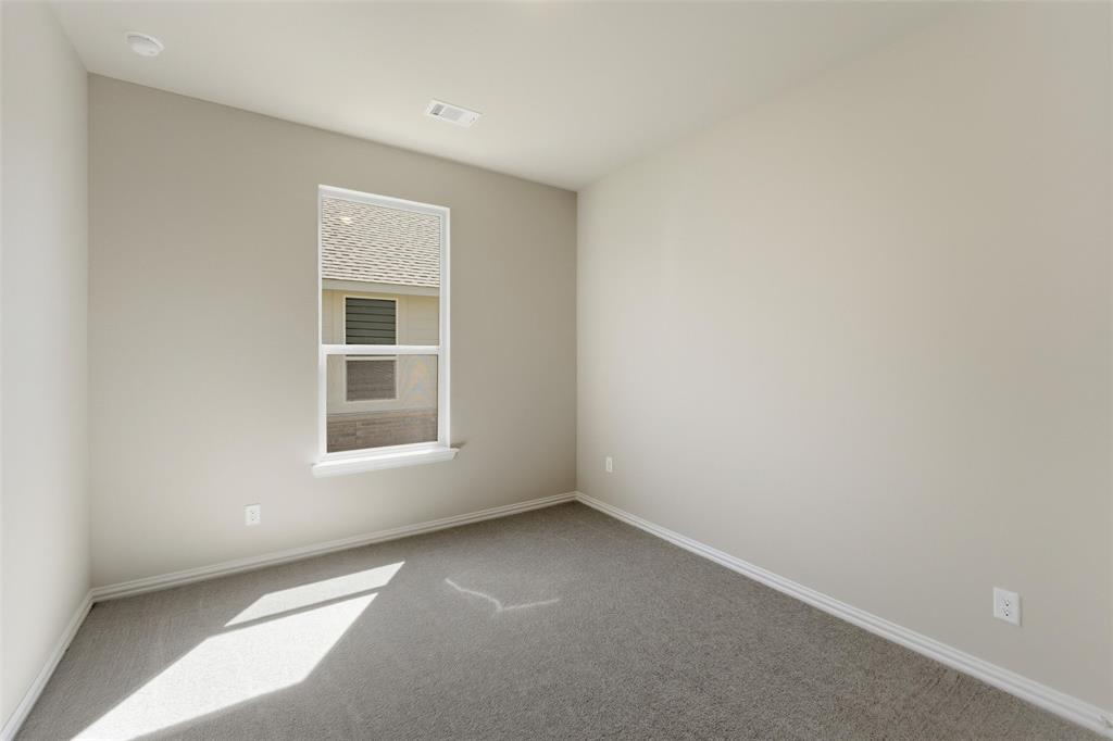 1229 Sabine River Lane Springtown, TX 76082 - Photo 12 of 26 an empty room with a window