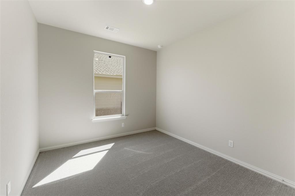 1229 Sabine River Lane Springtown, TX 76082 - Photo 13 of 26 a view of an empty room with a window