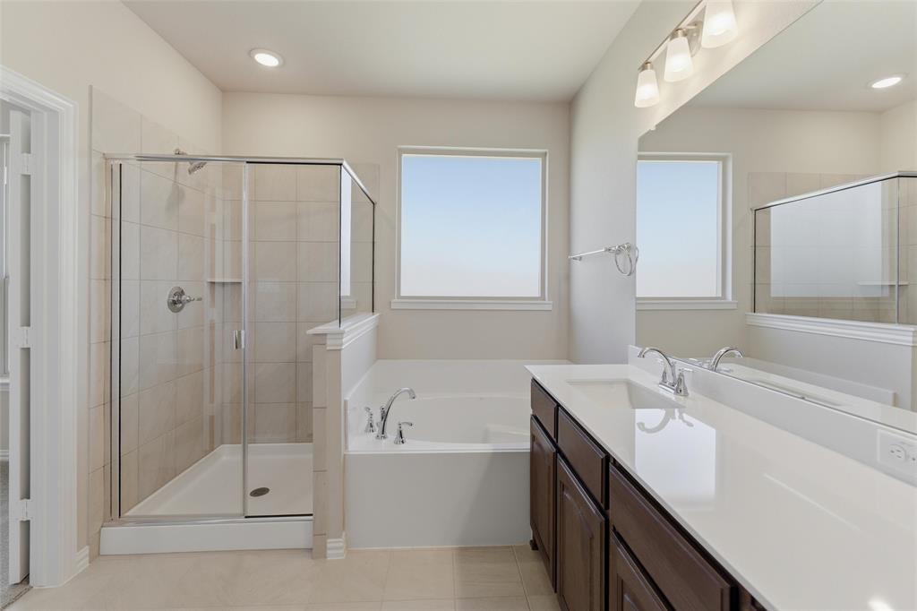 1229 Sabine River Lane Springtown, TX 76082 - Photo 18 of 26 a bathroom with a tub sink shower and mirror