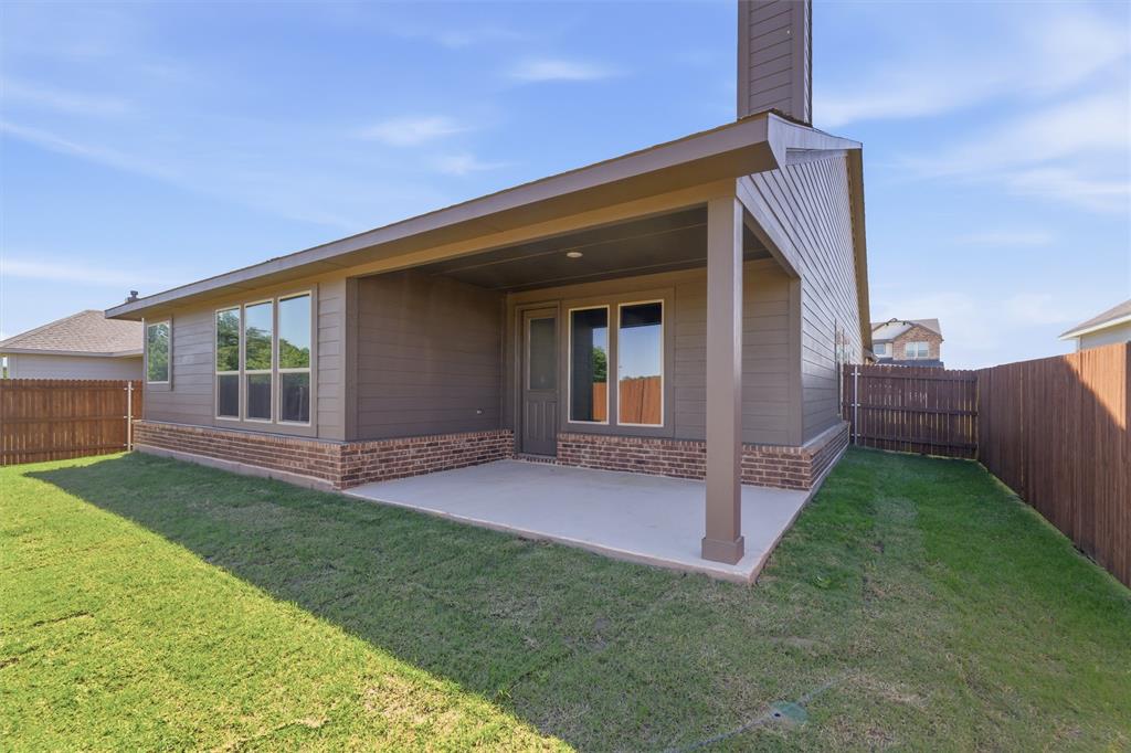 1229 Sabine River Lane Springtown, TX 76082 - Photo 22 of 26 a view of a house with backyard and porch