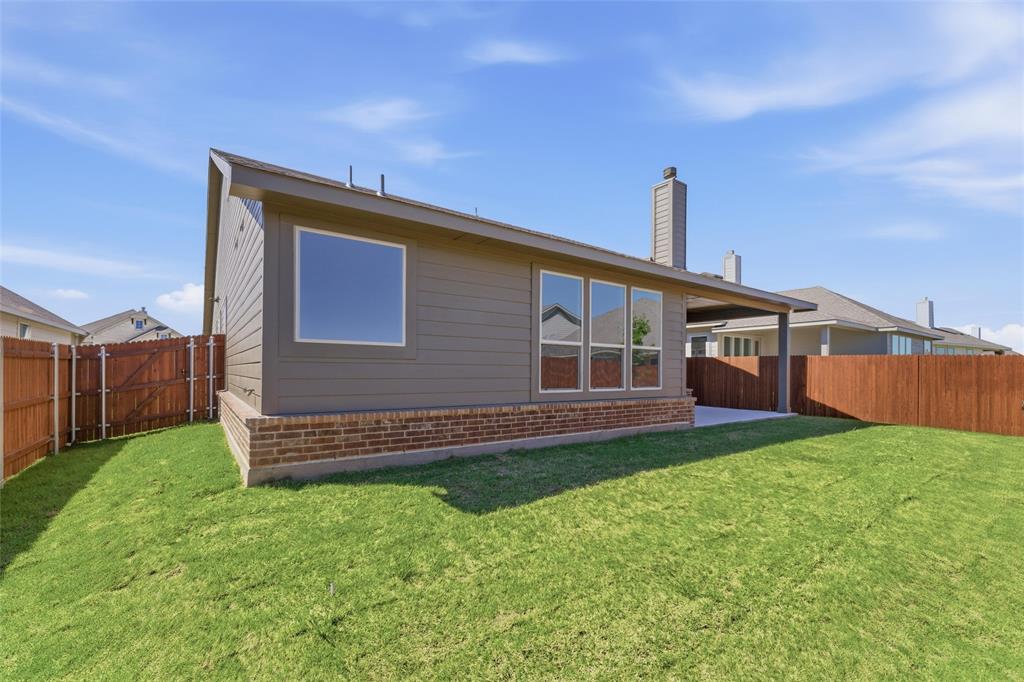 1229 Sabine River Lane Springtown, TX 76082 - Photo 24 of 26 a front view of a house with a yard