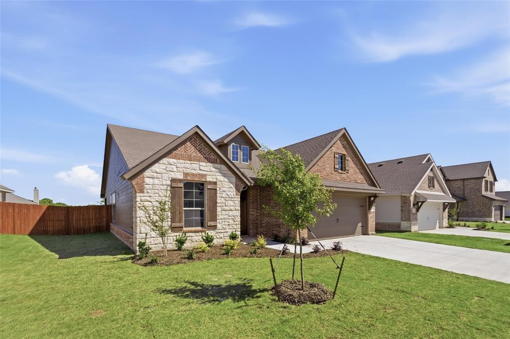 1229 Sabine River Lane Springtown, TX 76082 - Photo 4 of 26 a front view of house with yard and green space