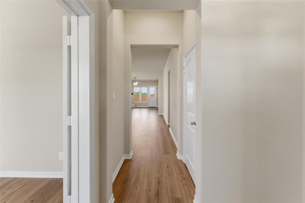 1229 Sabine River Lane Springtown, TX 76082 - Photo 5 of 26 a view of a hallway with wooden floor