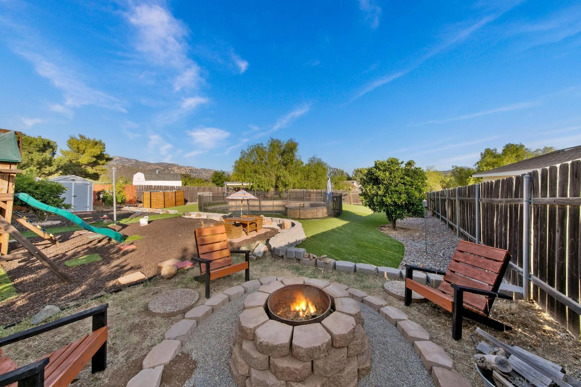 23849 Gymkhana Road Ramona, CA 92065 - Photo 11 of 57 a backyard of a house with table and chairs