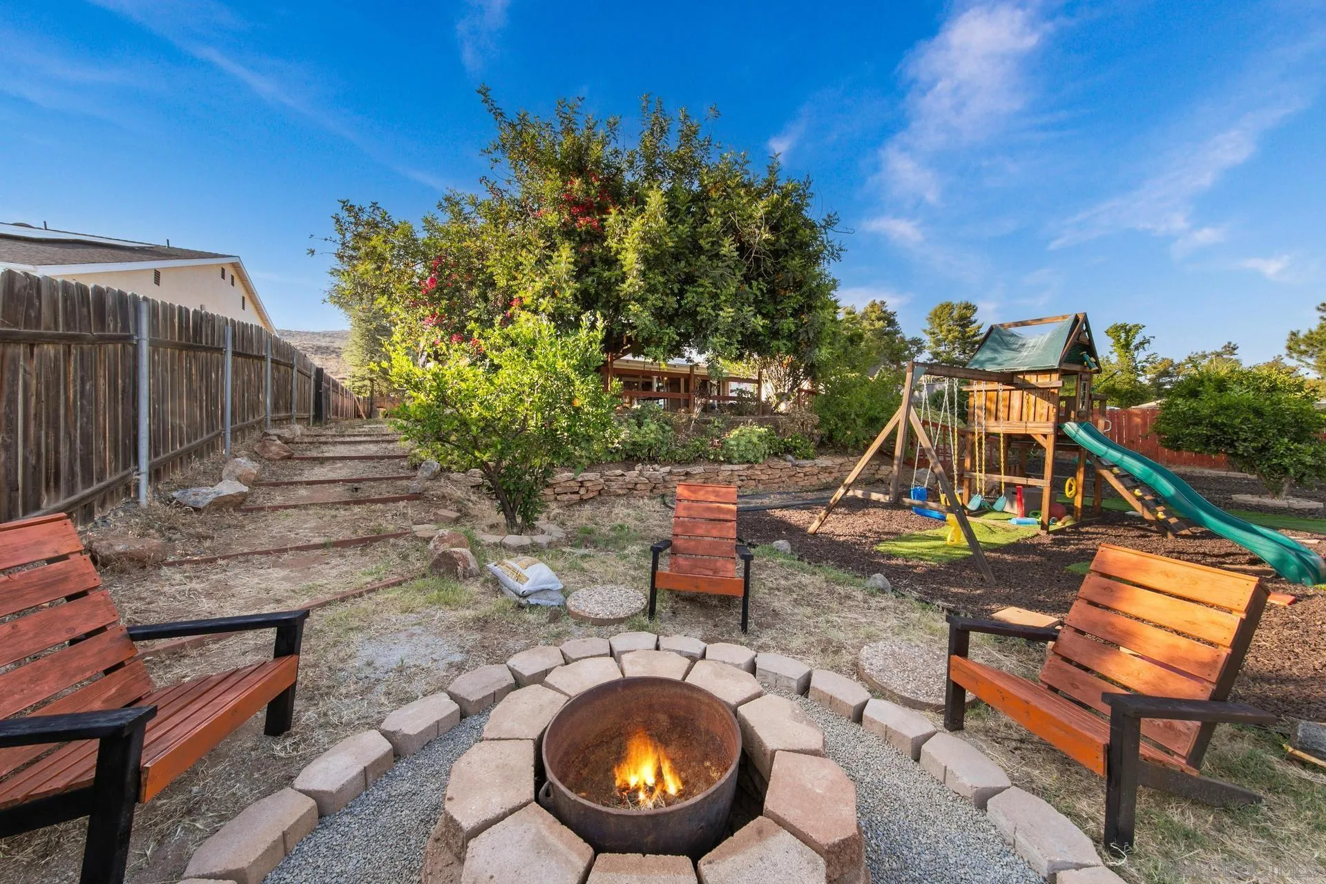 23849 Gymkhana Road Ramona, CA 92065 - Photo 12 of 57 a view of a backyard with plants and a patio