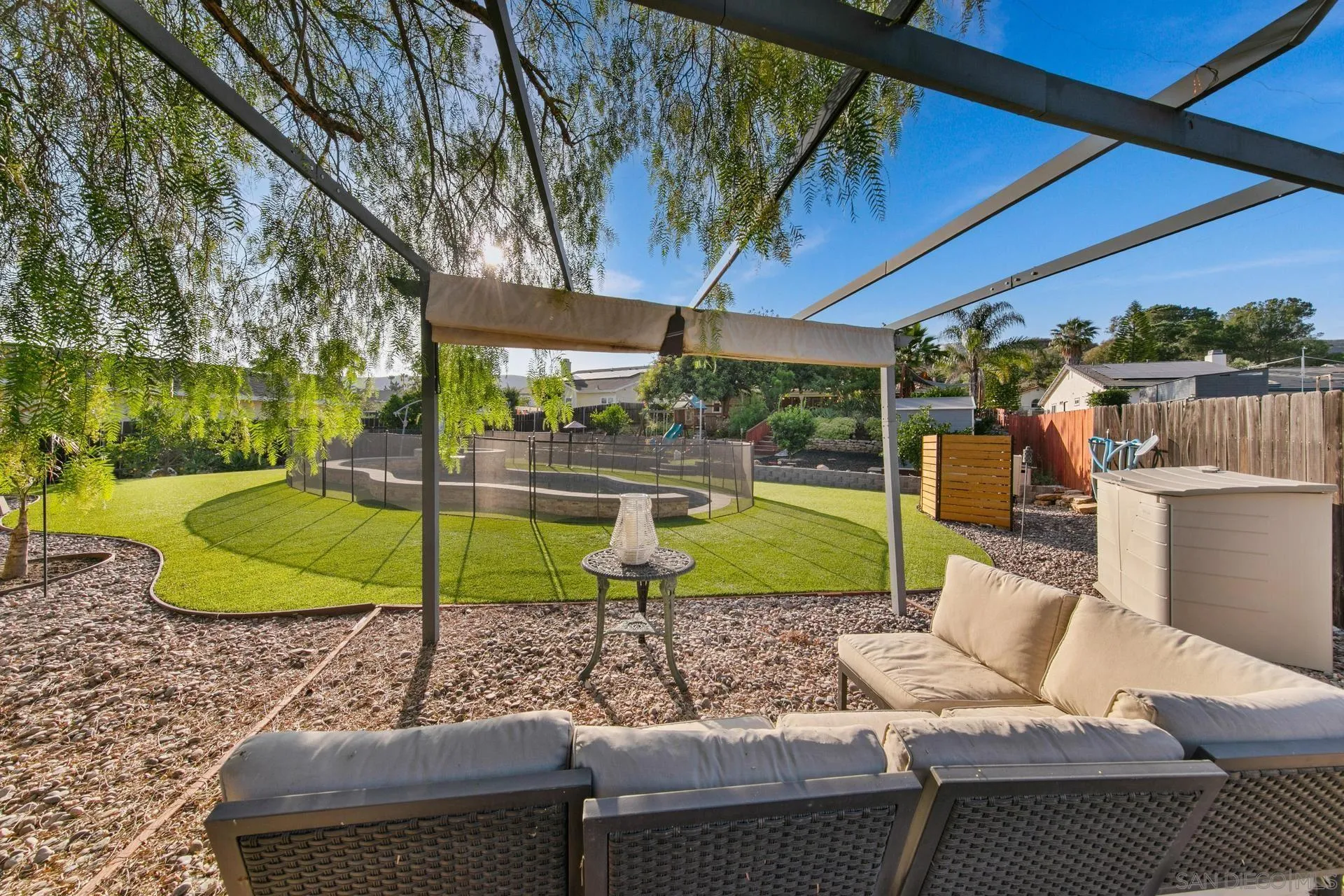 23849 Gymkhana Road Ramona, CA 92065 - Photo 15 of 57 a view of a backyard with plants and a patio
