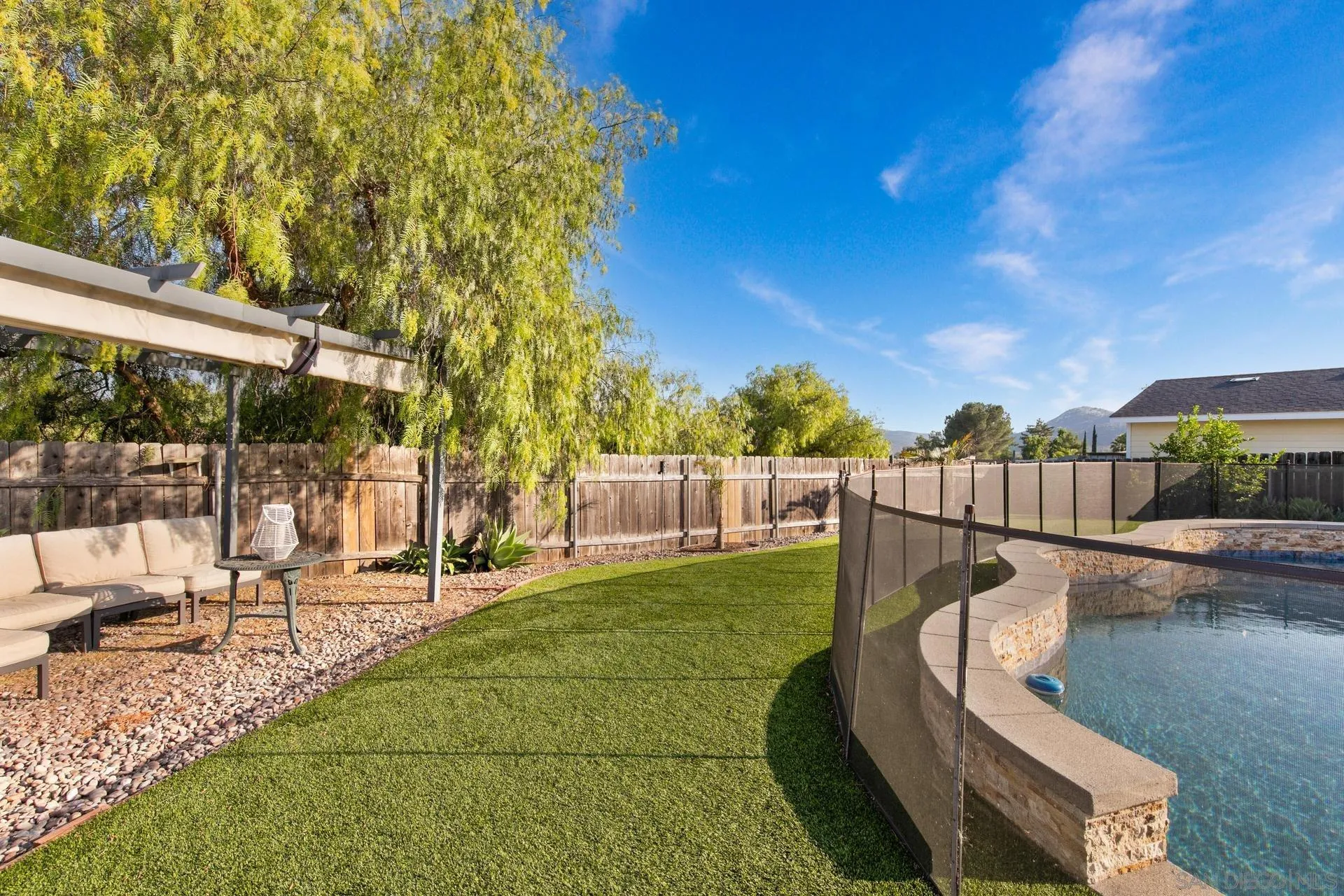 23849 Gymkhana Road Ramona, CA 92065 - Photo 16 of 57 a view of a swimming pool with a patio