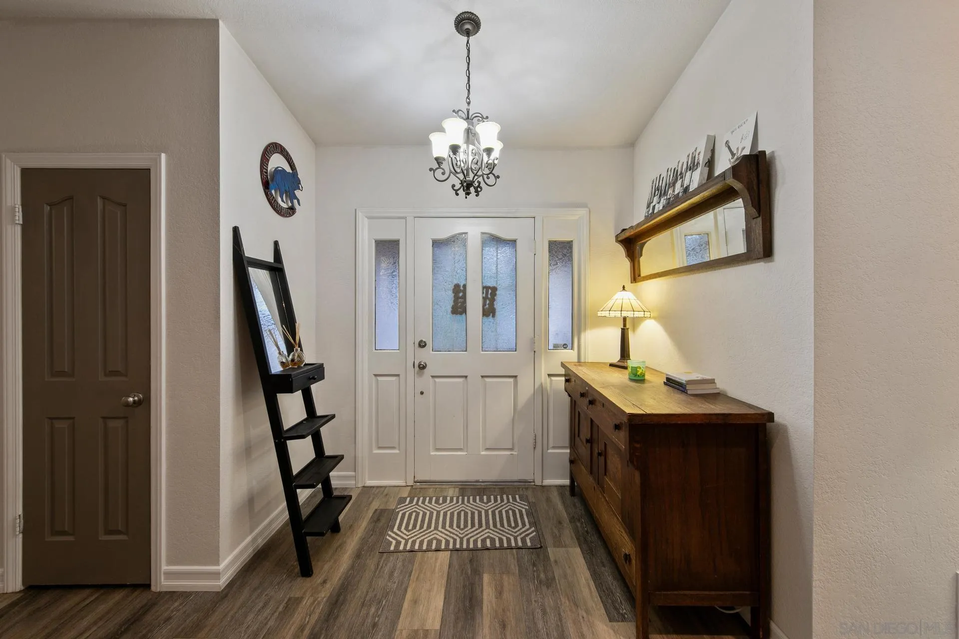 23849 Gymkhana Road Ramona, CA 92065 - Photo 23 of 57 a view of a hallway with wooden floor and staircase