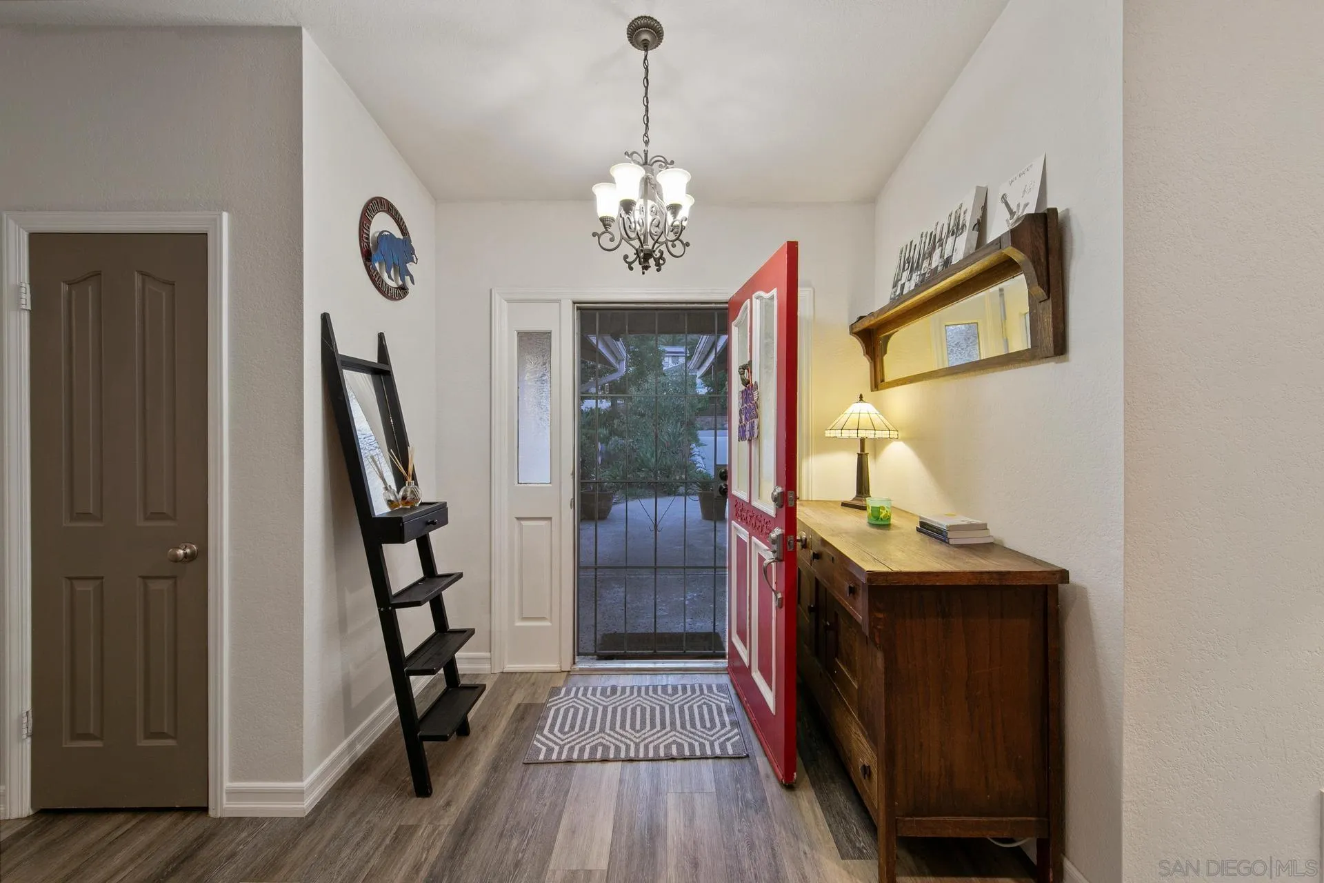 23849 Gymkhana Road Ramona, CA 92065 - Photo 24 of 57 a view of a hallway with wooden floor and staircase