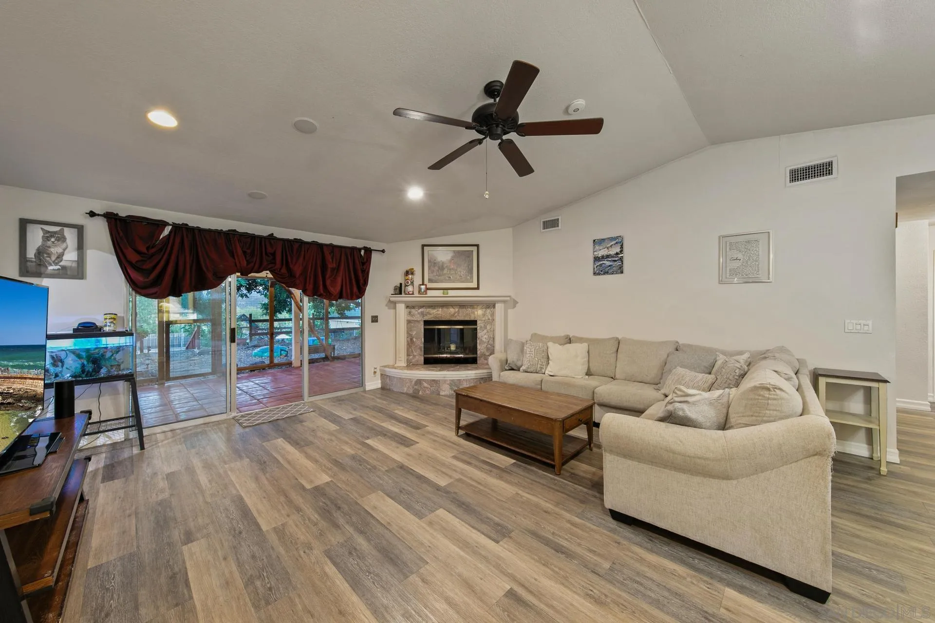 23849 Gymkhana Road Ramona, CA 92065 - Photo 25 of 57 a living room with furniture and a fireplace