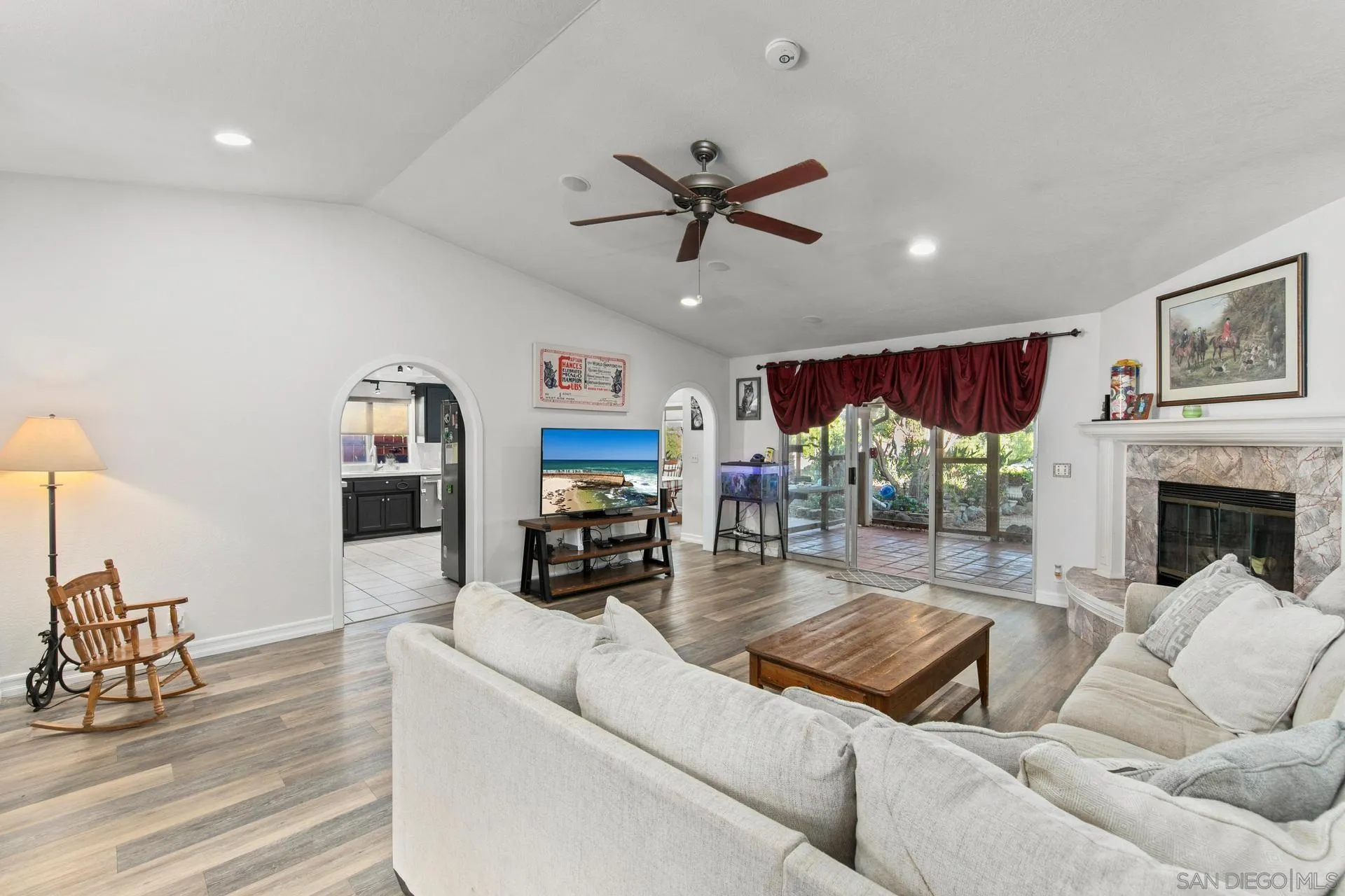 23849 Gymkhana Road Ramona, CA 92065 - Photo 27 of 57 a living room with furniture and a fireplace