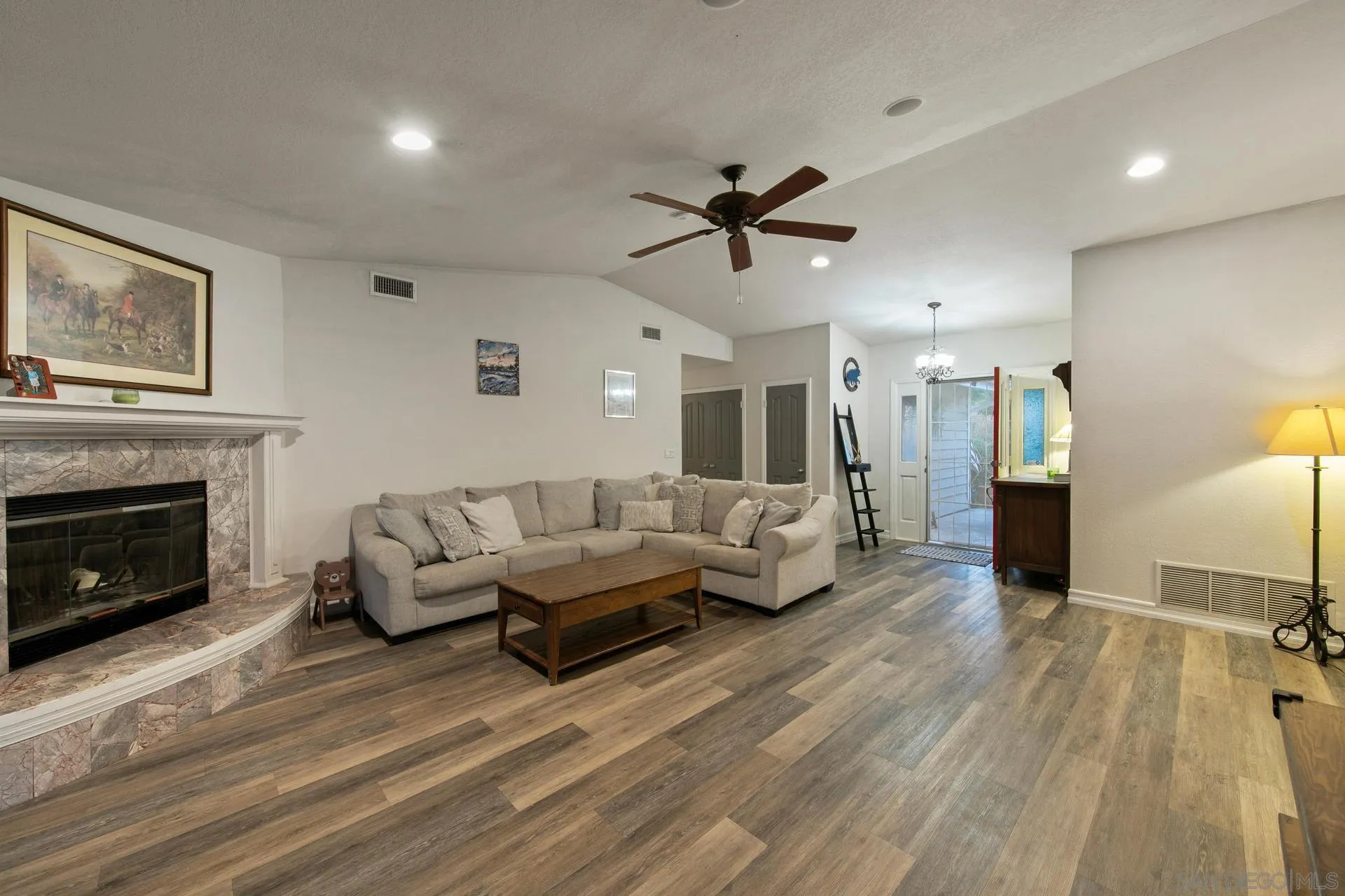 23849 Gymkhana Road Ramona, CA 92065 - Photo 28 of 57 a living room with furniture and a fireplace