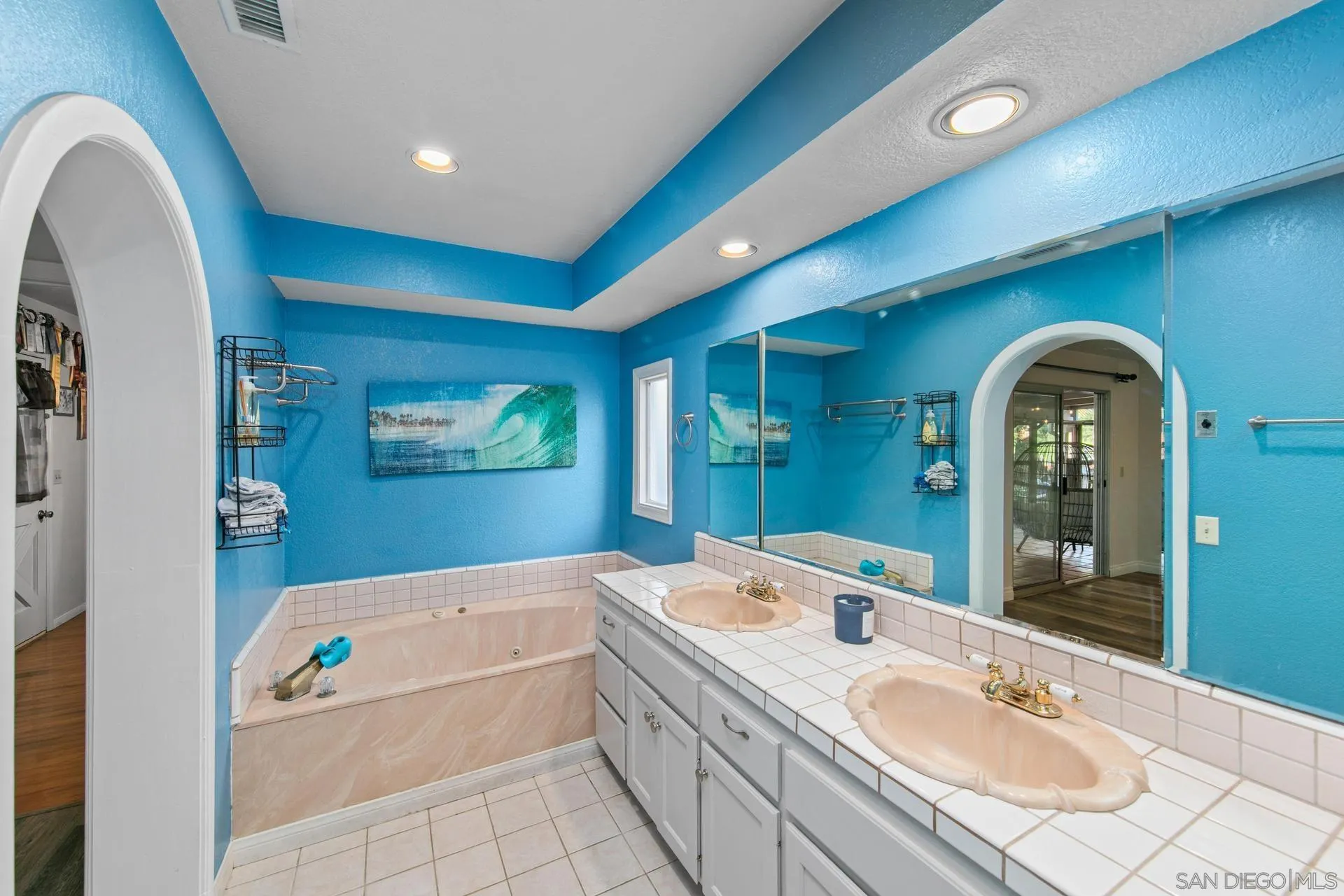 23849 Gymkhana Road Ramona, CA 92065 - Photo 32 of 57 a en suite bathroom with a granite countertop tub a double vanity sink a mirror and shower