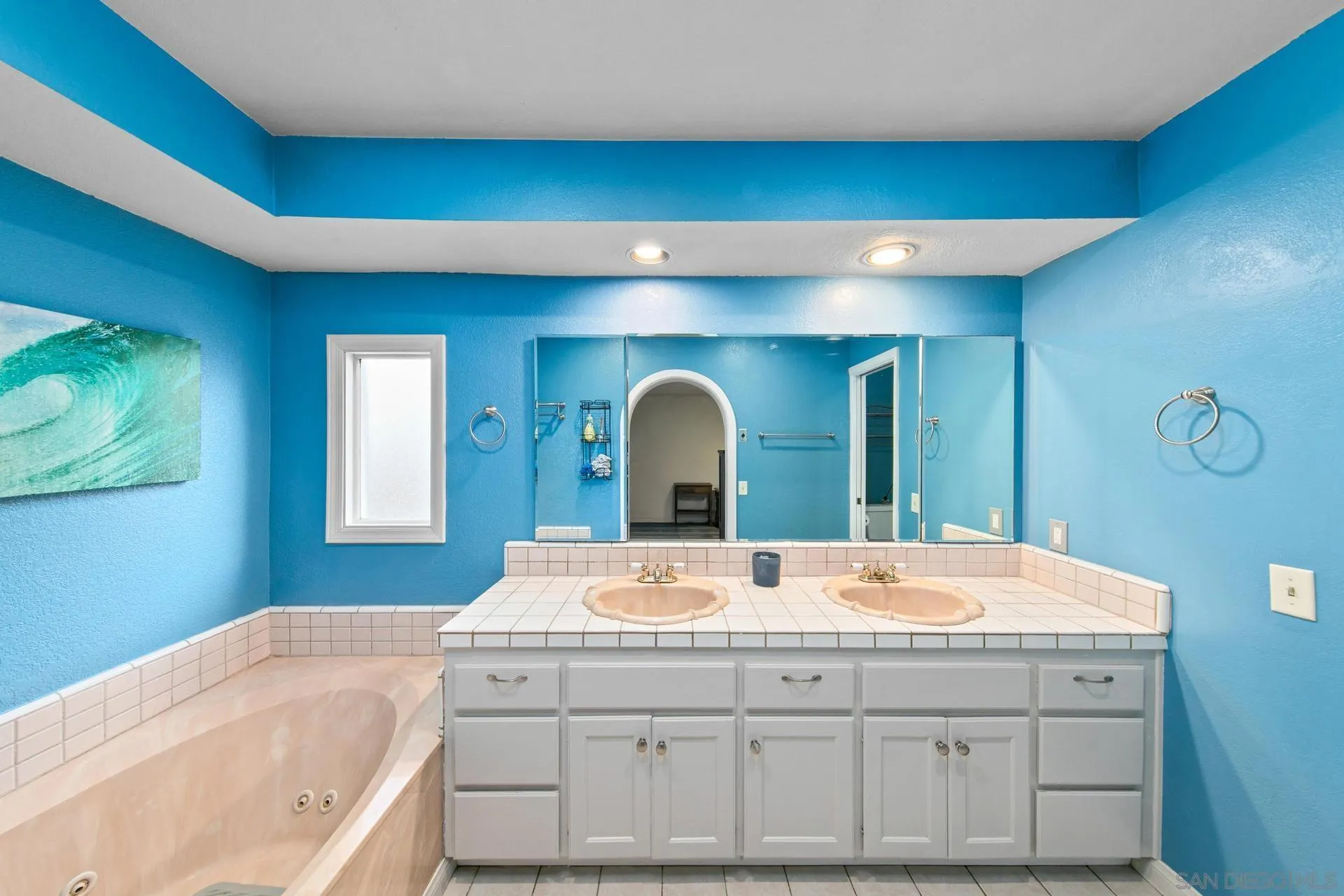 23849 Gymkhana Road Ramona, CA 92065 - Photo 33 of 57 a bathroom with a double vanity sink and a bathtub