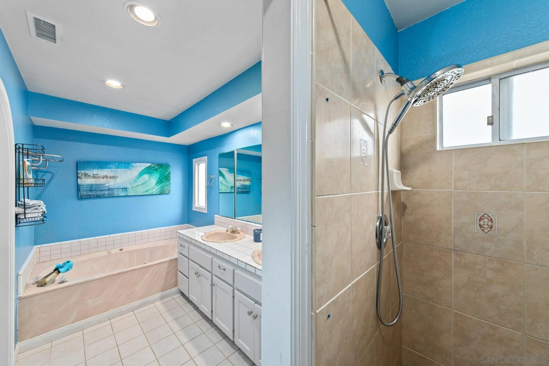 23849 Gymkhana Road Ramona, CA 92065 - Photo 34 of 57 a bathroom with a tub a sink and glass door shower