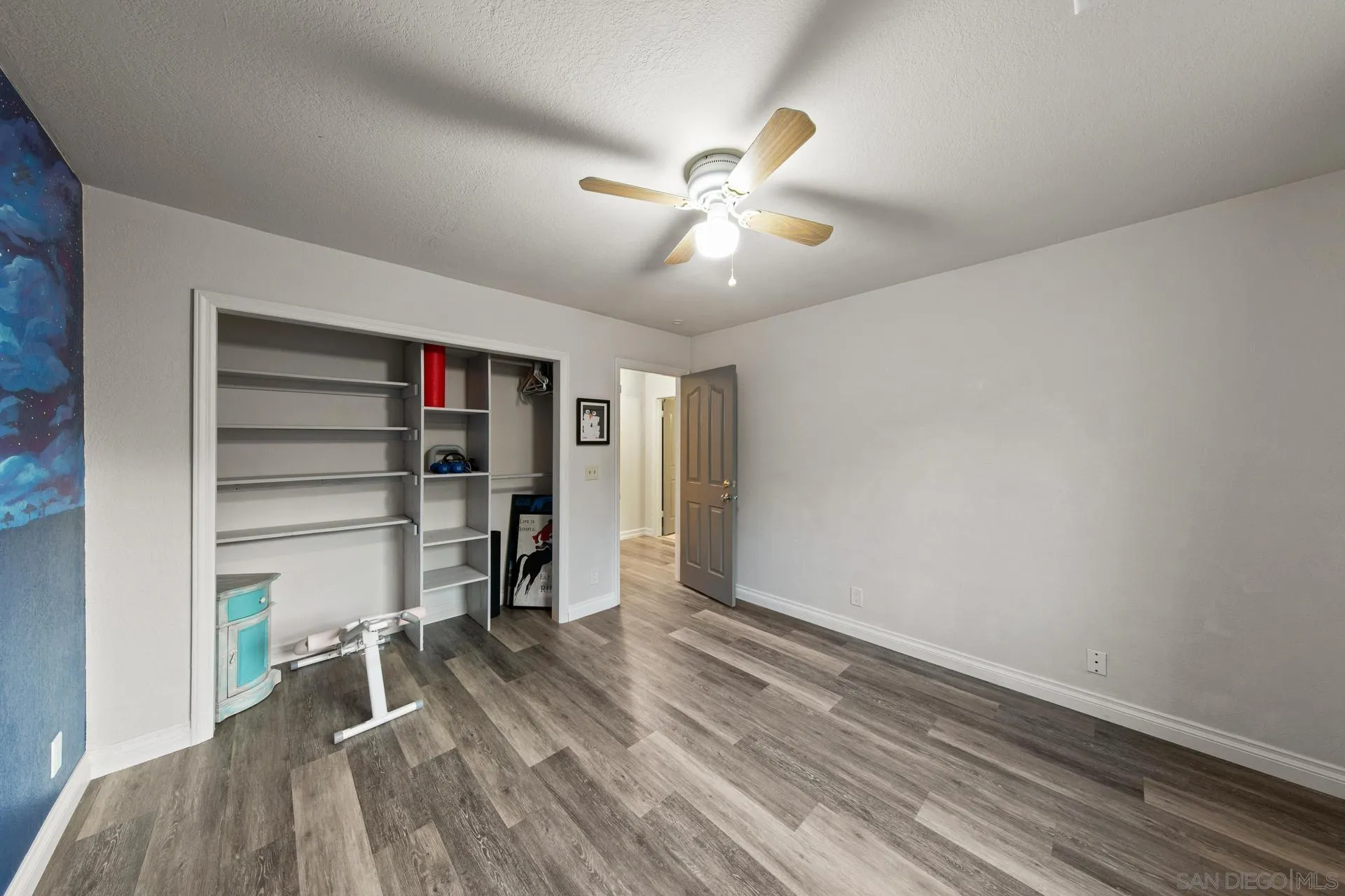 23849 Gymkhana Road Ramona, CA 92065 - Photo 39 of 57 a view of empty room with wooden floor and fan