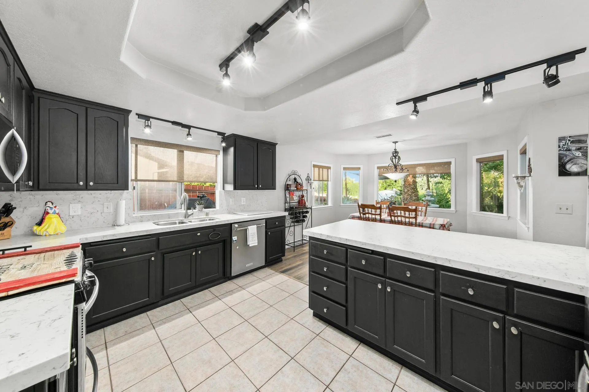 23849 Gymkhana Road Ramona, CA 92065 - Photo 40 of 57 a large kitchen with stainless steel appliances granite countertop a sink and cabinets