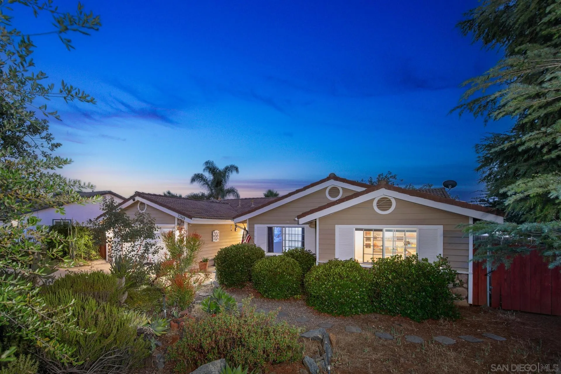 23849 Gymkhana Road Ramona, CA 92065 - Photo 4 of 57 a front view of a house with a yard