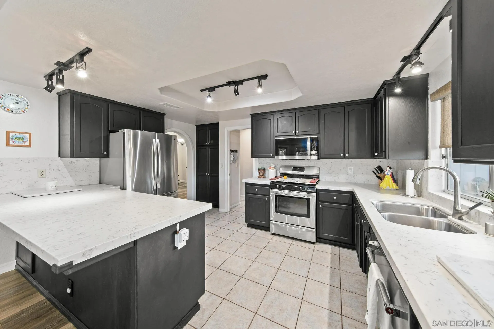 23849 Gymkhana Road Ramona, CA 92065 - Photo 41 of 57 a kitchen with a stove a sink and a refrigerator