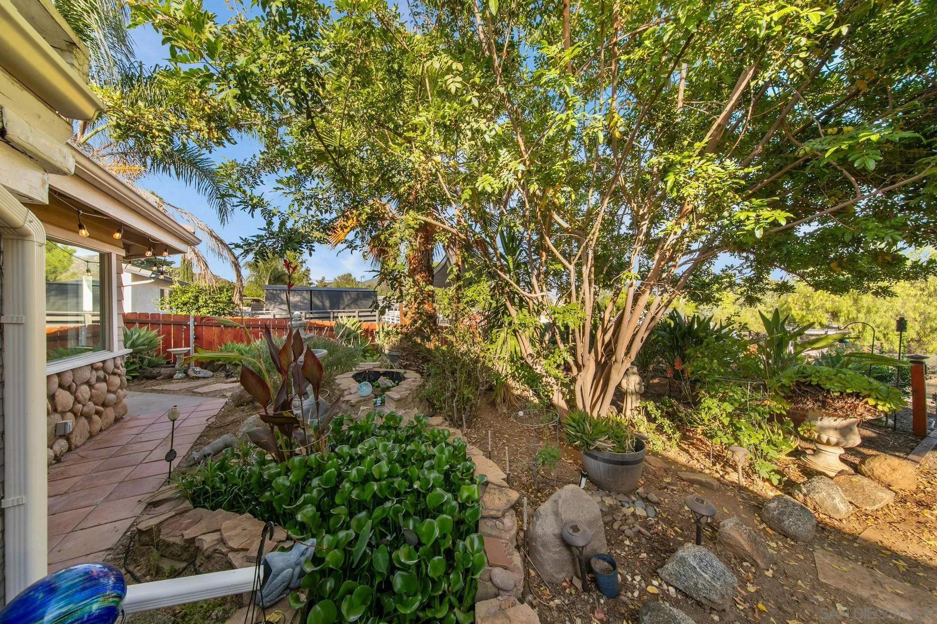 23849 Gymkhana Road Ramona, CA 92065 - Photo 8 of 57 a backyard of a house with lots of green space