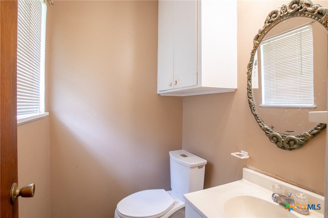 2903 Gayle Street Victoria, TX 77901 - Photo 14 of 21 a bathroom with a toilet and a sink