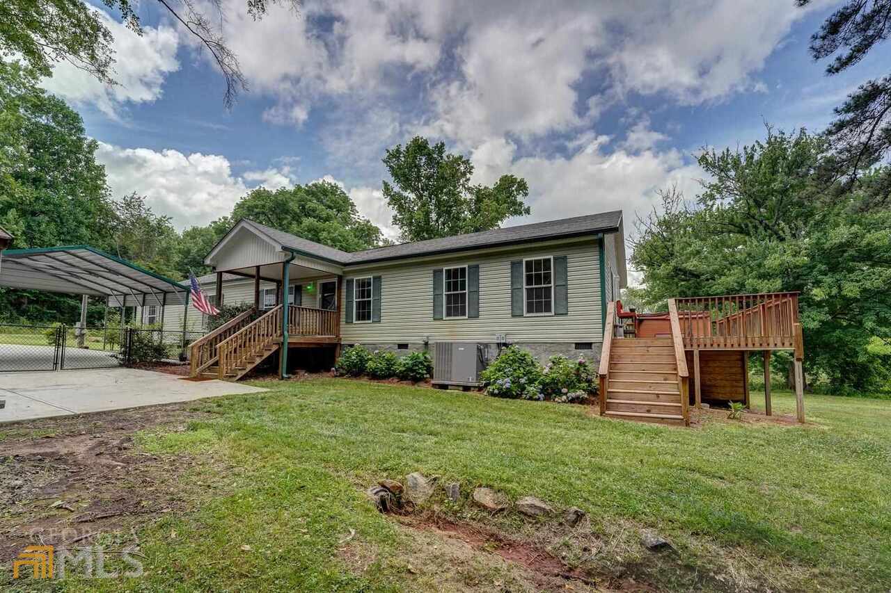 198 Southern Shores Road Jackson, GA 30233 - Photo 1 of 1 a view of a house with a yard and sitting area