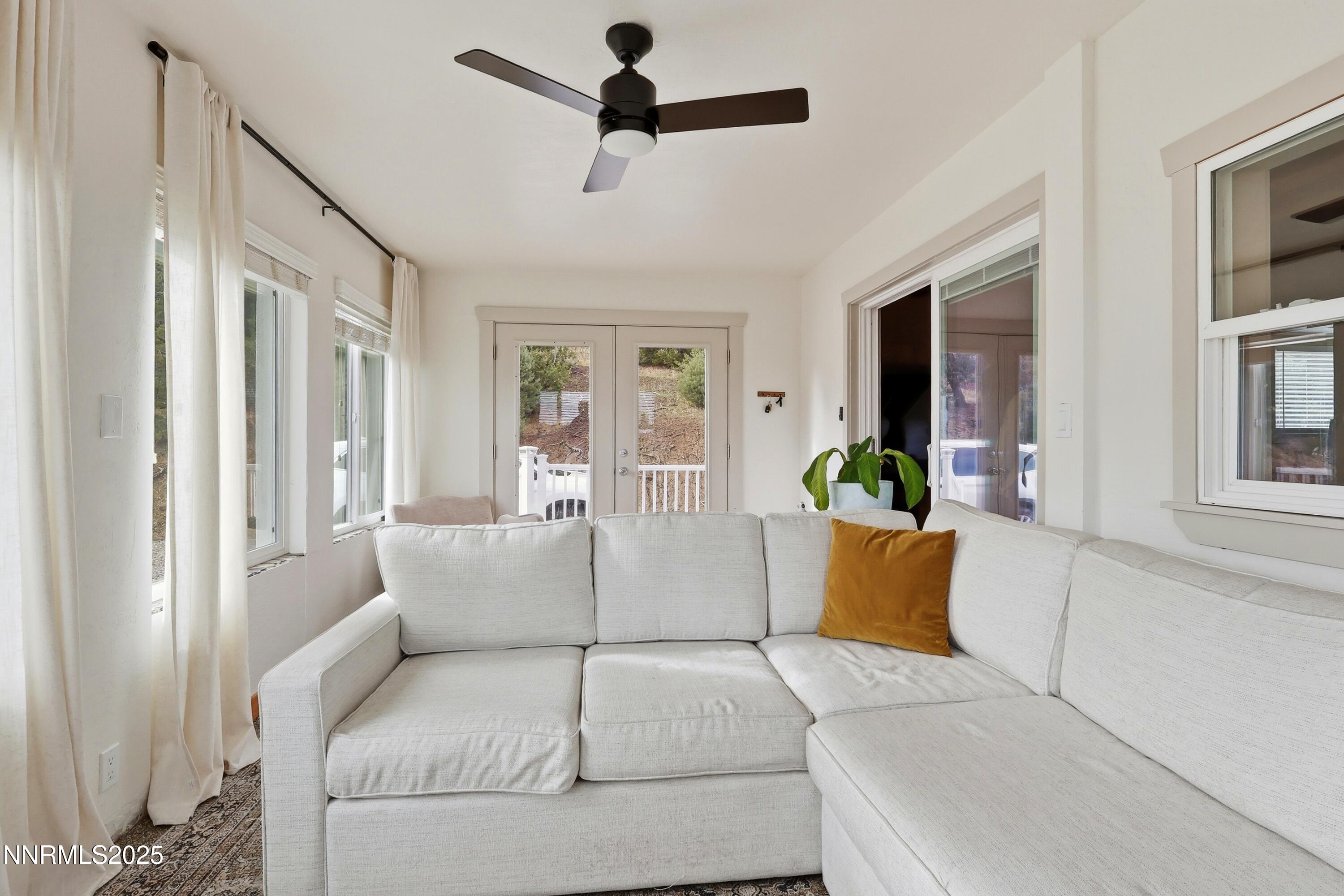 1590 Combination Road Reno, NV 89521 - Photo 16 of 41 a living room with furniture and a chandelier