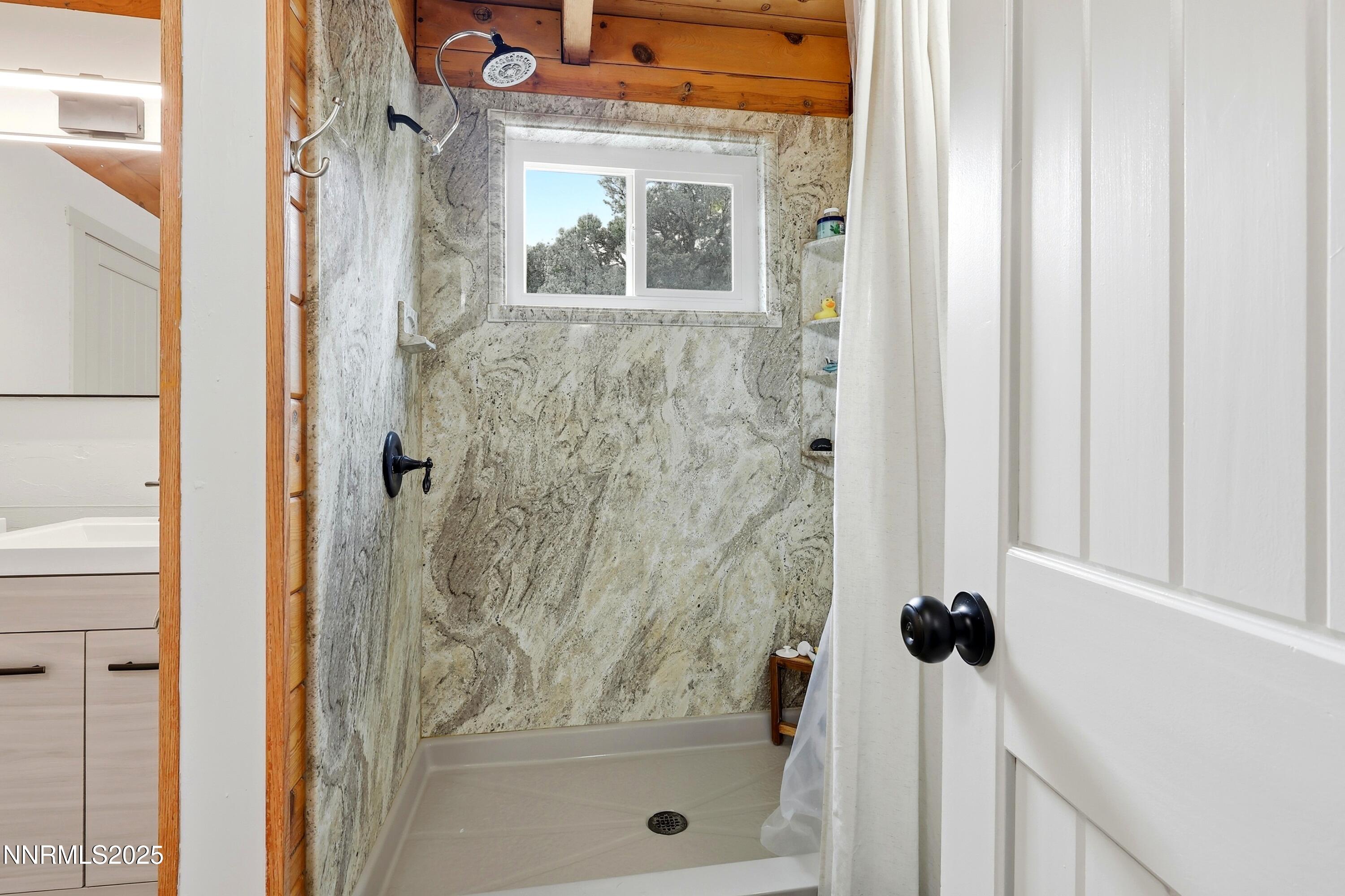 1590 Combination Road Reno, NV 89521 - Photo 36 of 41 a bathroom with a glass shower door