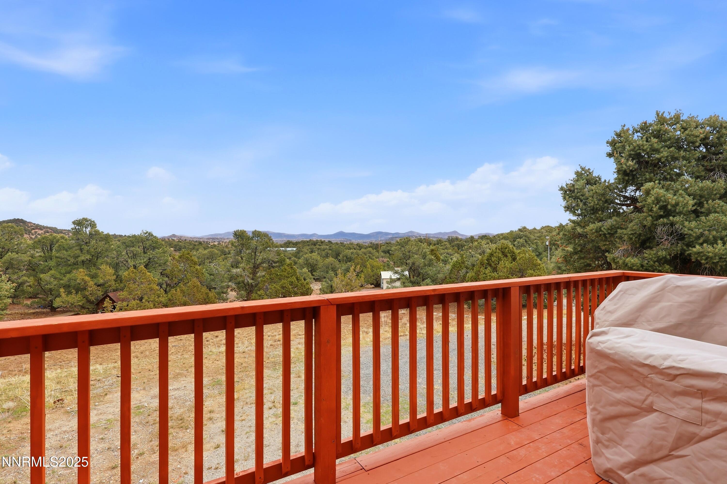 1590 Combination Road Reno, NV 89521 - Photo 5 of 41 a balcony with wooden floor and fence