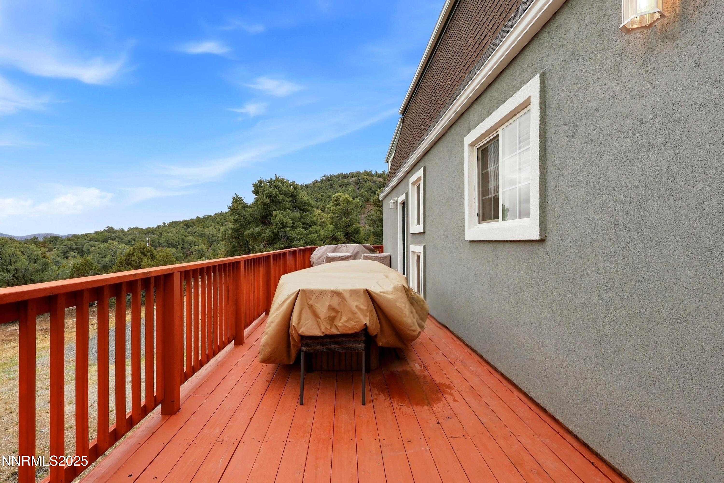 1590 Combination Road Reno, NV 89521 - Photo 9 of 41 a balcony with wooden floor and fence