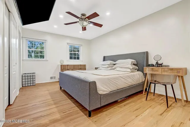 a bedroom with a bed and a table in it