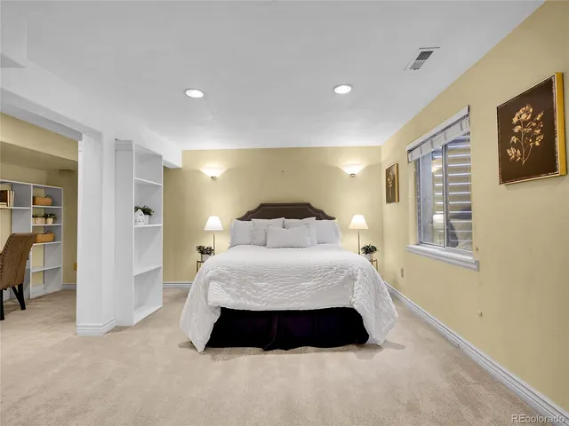 a spacious bedroom with a bed and walk in closet