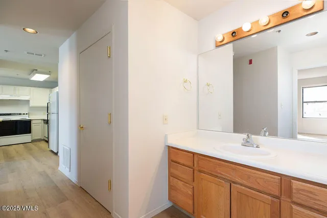 a bathroom with a sink and a mirror