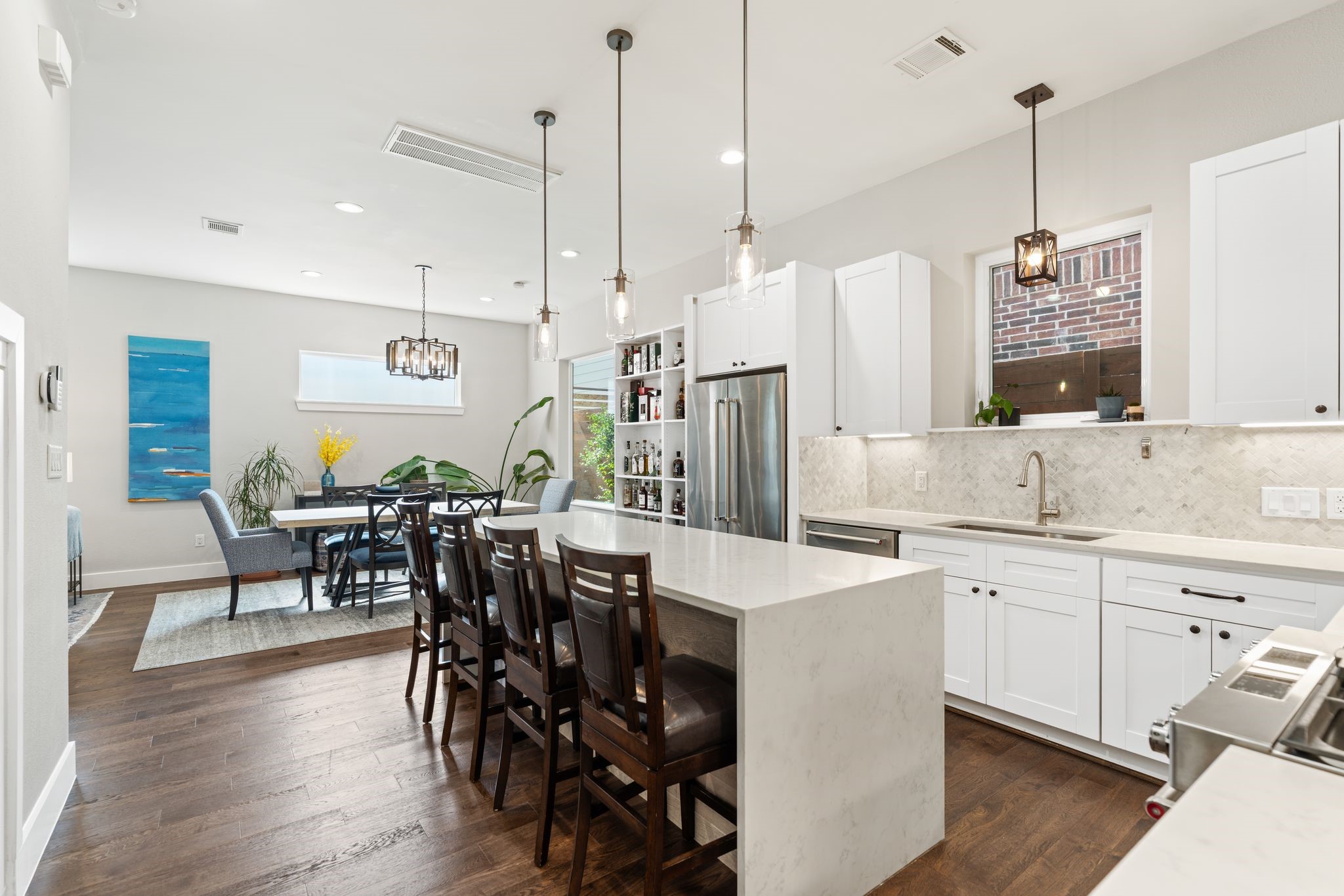 807 Nicholson Street Houston, TX 77007 - Photo 13 of 30 Equipped with stainless steel appliances, a gas range, beverage fridge, and under-cabinet lighting for both function and style.