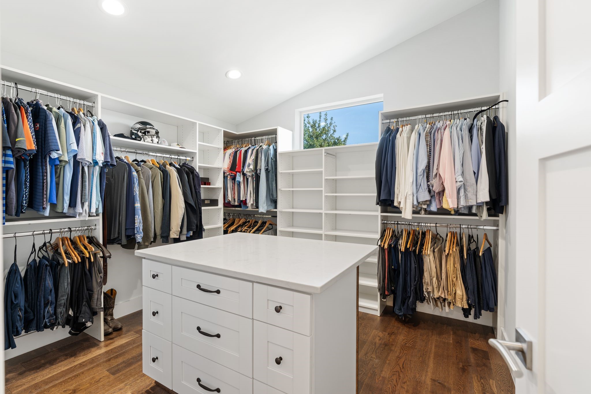 807 Nicholson Street Houston, TX 77007 - Photo 22 of 30 Spacious, custom-style walk-in closet showcasing substantial built-in storage and a center island for added organization.