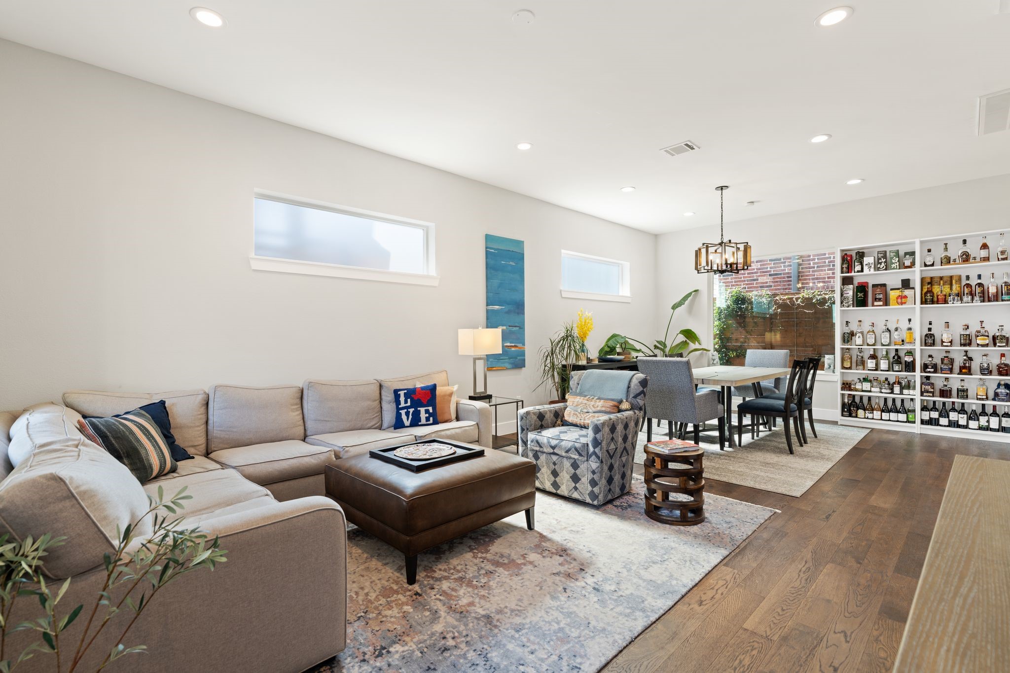 807 Nicholson Street Houston, TX 77007 - Photo 7 of 30 High ceilings and recessed lighting pair with hardwood floors to create an airy, light-filled living space.
