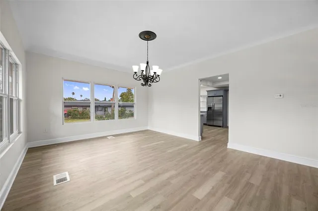 a bathroom with a granite countertop toilet sink and mirror