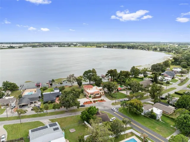 a view of a swimming pool with a yard
