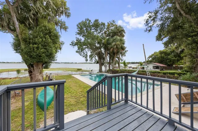 a view of swimming pool with a yard
