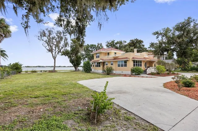 an aerial view of a houses with outdoor space