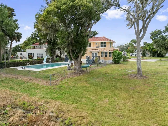 an aerial view of a house with outdoor space