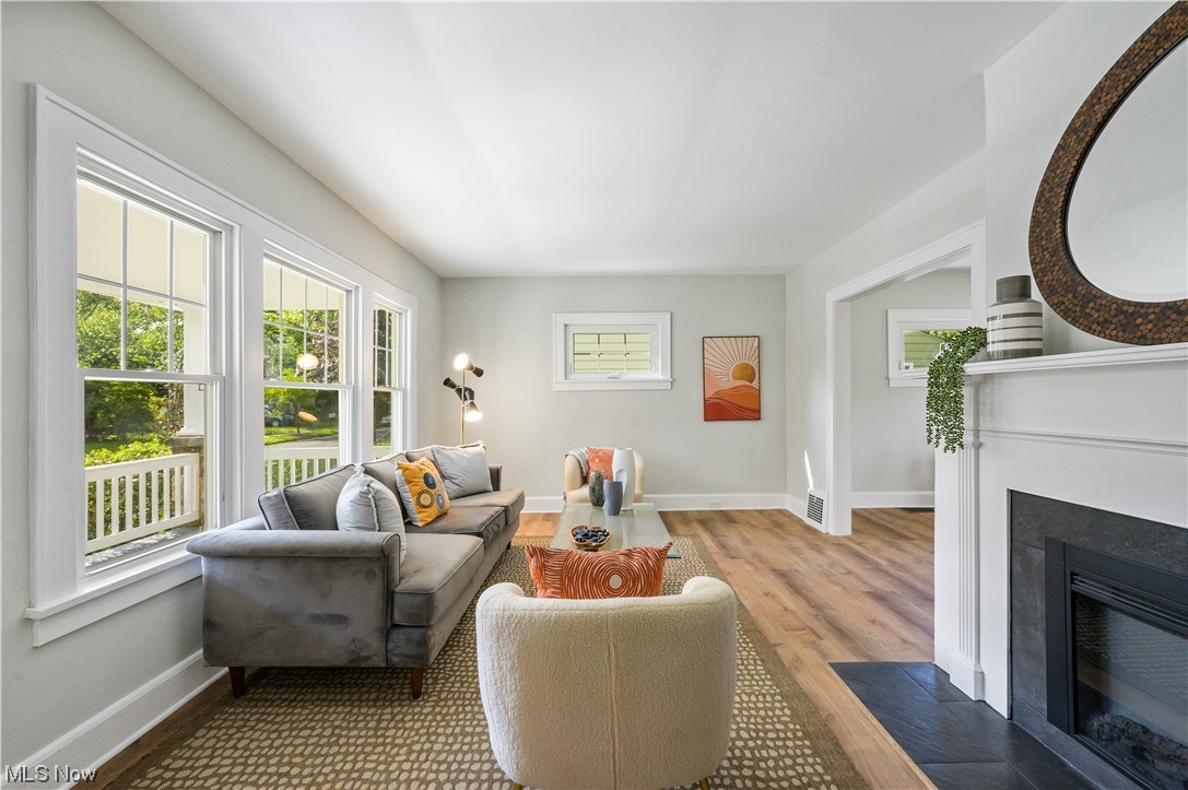 1606 Maple Road Cleveland Heights, OH 44121 - Photo 5 of 30 New luxury vinyl plank flooring throughout(2023).
Inviting foyer opens to the spacious, sun-filled living room with new fireplace