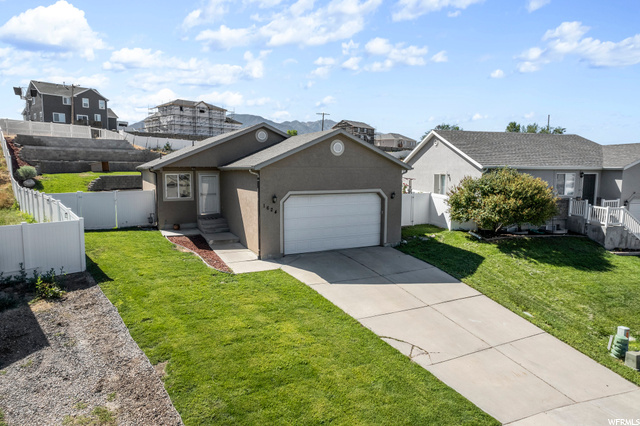 1624 East Ridgefield Road Spanish Fork, UT 84660 - Photo 1 of 1 View of front of home with a front lawn and a garage