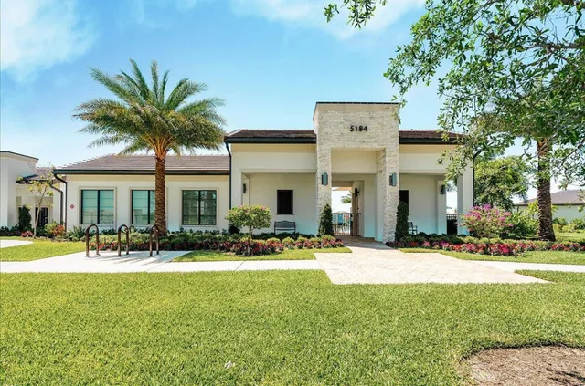 a view of a building with a yard